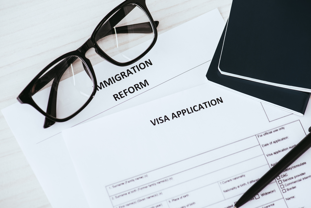 documents with lettering near glasses and passports documents with lettering near glasses and passports