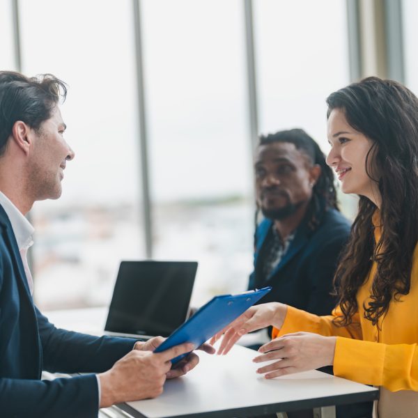 Happy business manager working at office meeting. Smiling male hr hiring recruit at job interview, bank or insurance agent, lawyer making contract deal with client at work, young business woman worker